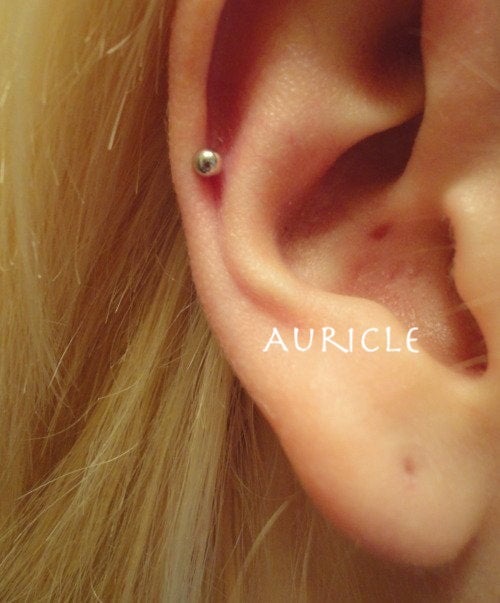 Auricle (low helix placement) Faithful piercing